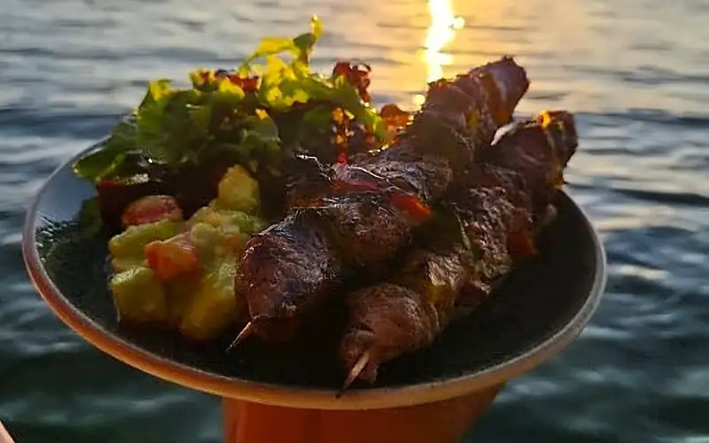 Skewers at sunset over the ocean